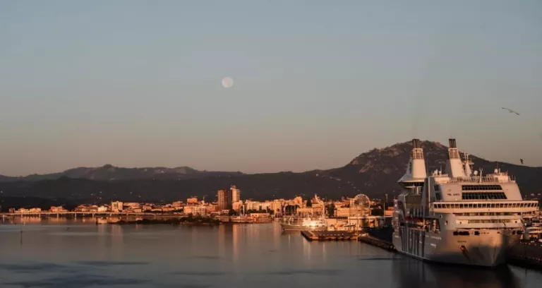 Full Moon In The Evening Sky Over The Harbor In Olbia Italy 1