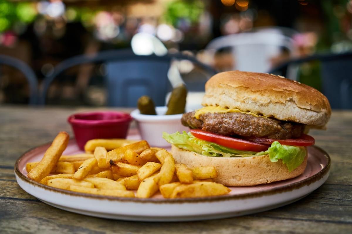 burger and fries on white plate