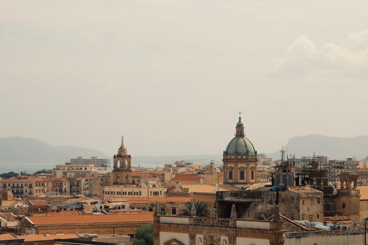 dome of palermo cathedral over buildings in city