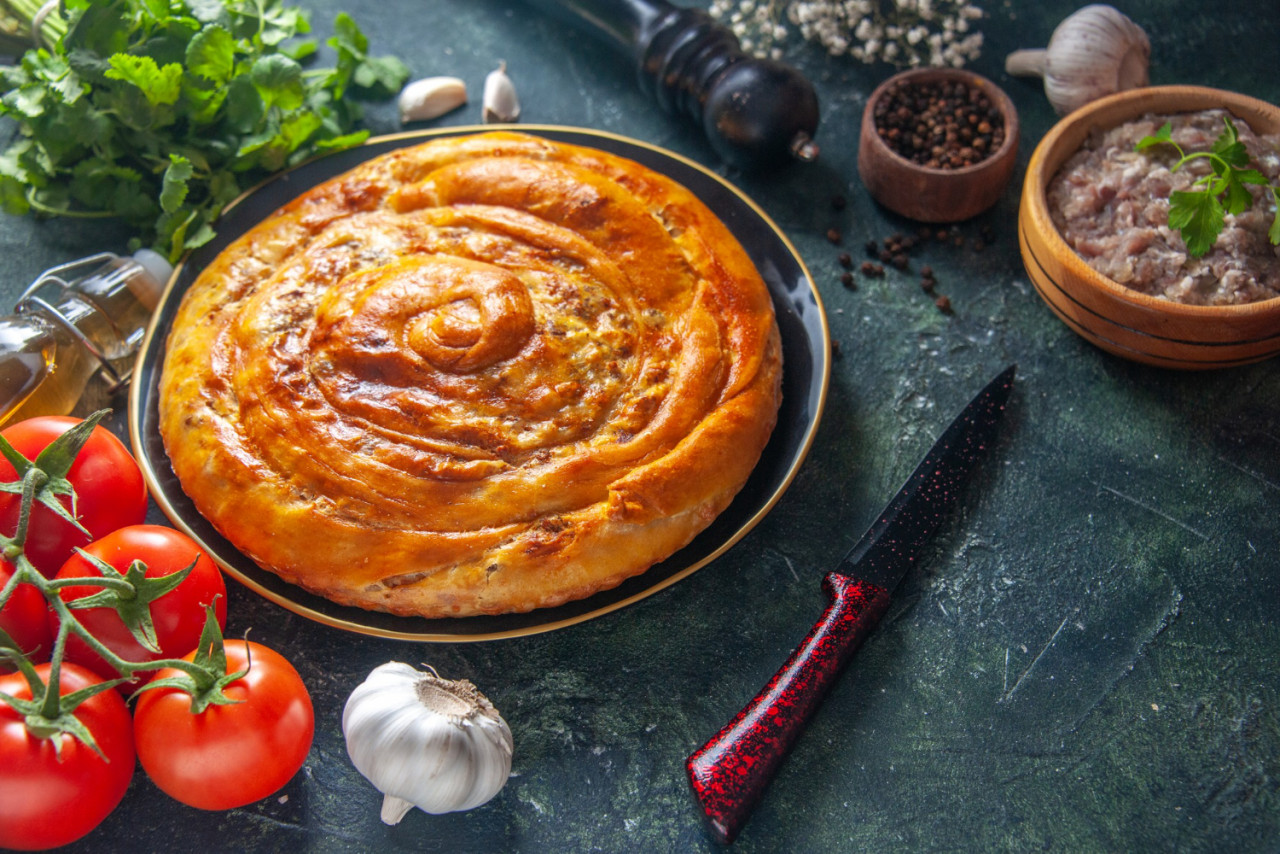 front view tasty meat pie inside pan with tomatoes dark background cake food bake dough oven pie pastry biscuit