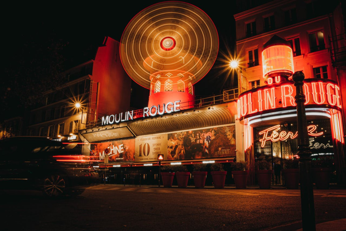 neon lights above the entrance to moulin rouge paris france