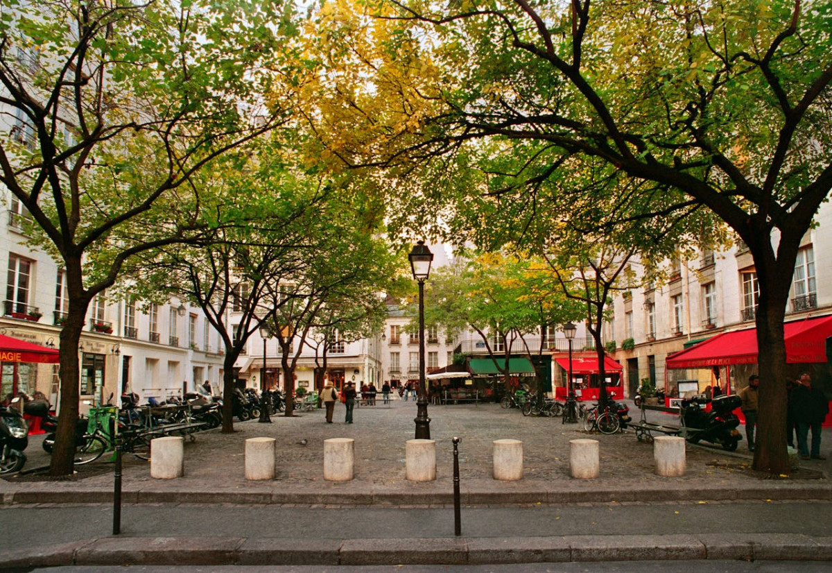 photo of a plaza with restaurants during fall