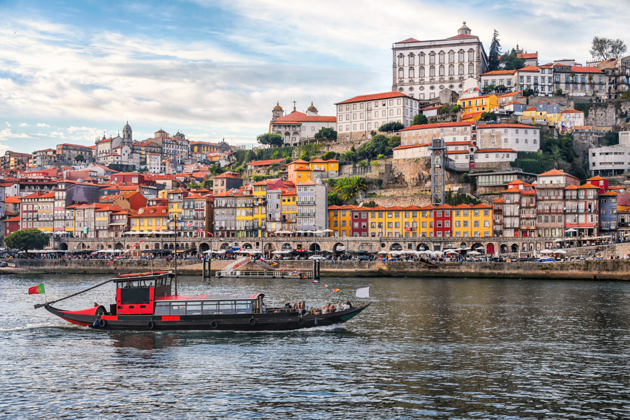 porto portugal old town ribeira aerial promenade view with colorful houses traditional facades old multi colored houses with red roof tiles douro river boats