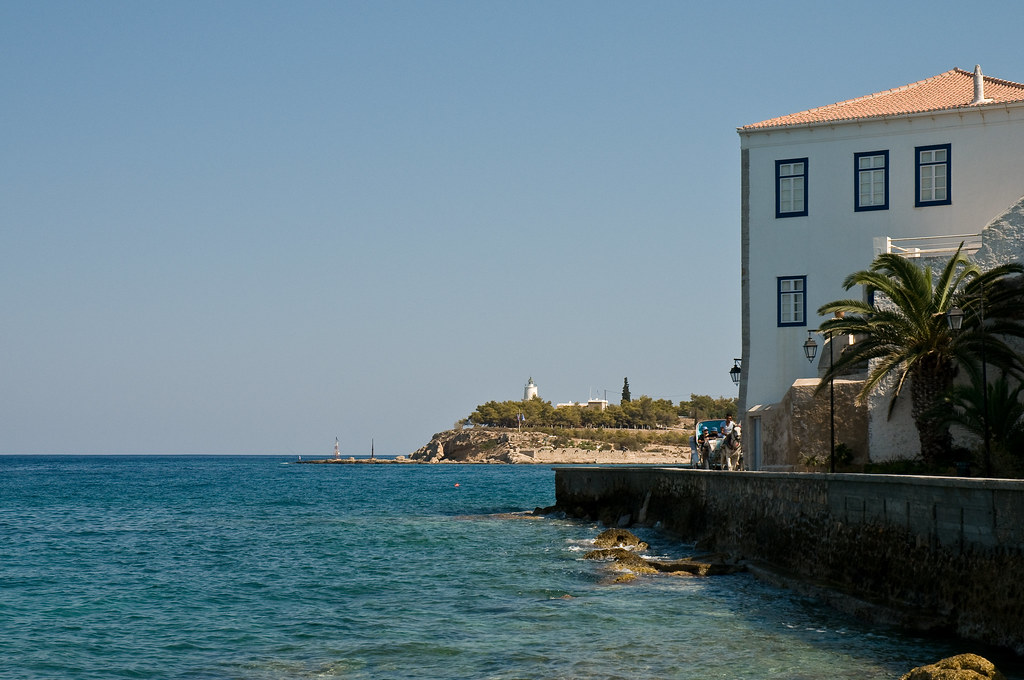 aerial view of a small bay and busy streets at spetses greece with water taxis for island hopping