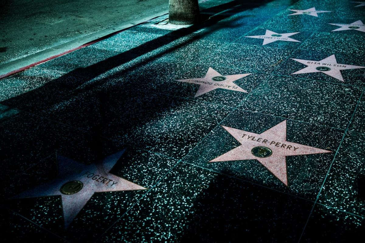 stars on gray and black tiled sidewalk