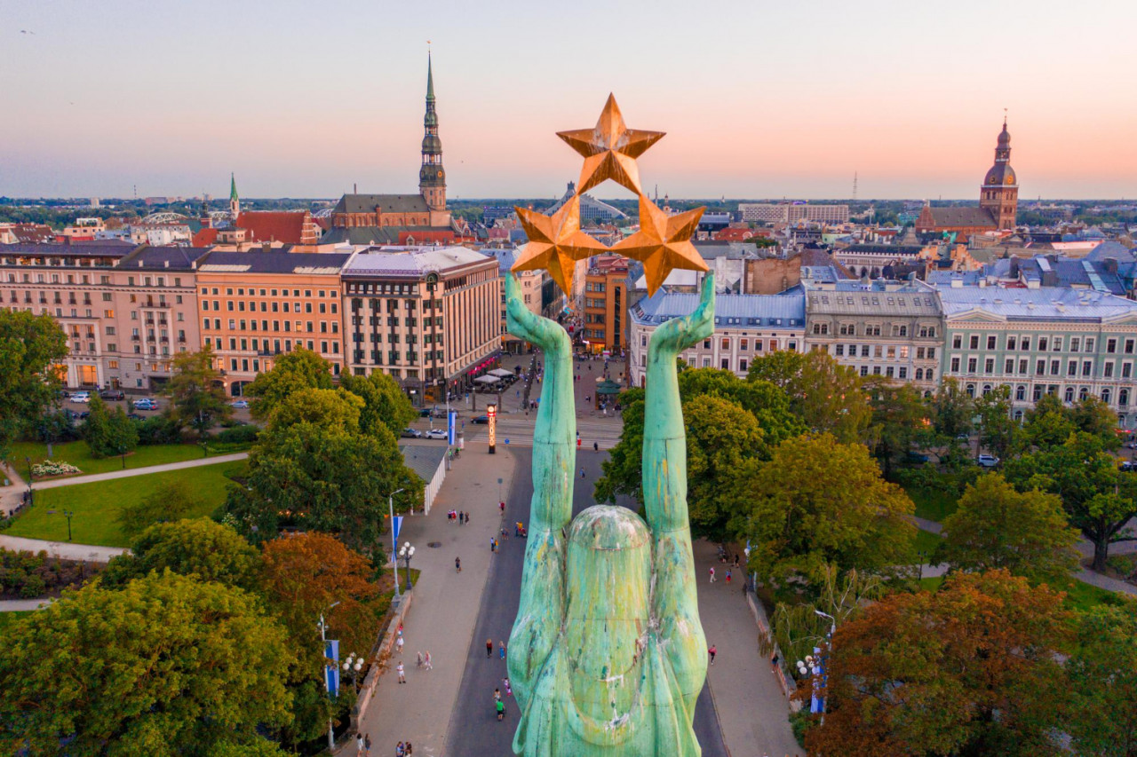 riga 20 july 2020 amazing aerial view statue liberty milda riga latvia during sunset statue liberty holding three golden stars