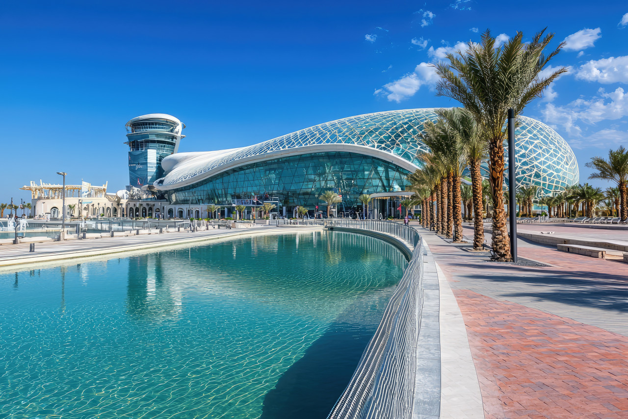 stunning view yas island attractions featuring modern architecture palm trees serene waterway clear blue sky this vibrant scene captures essence leisure entertainment