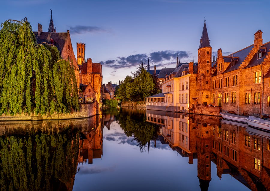 view of canal and brick buildings in bruges belgium